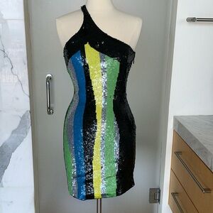 One shoulder sequin sexy dress.  Very flattering. Stretchy with side zip